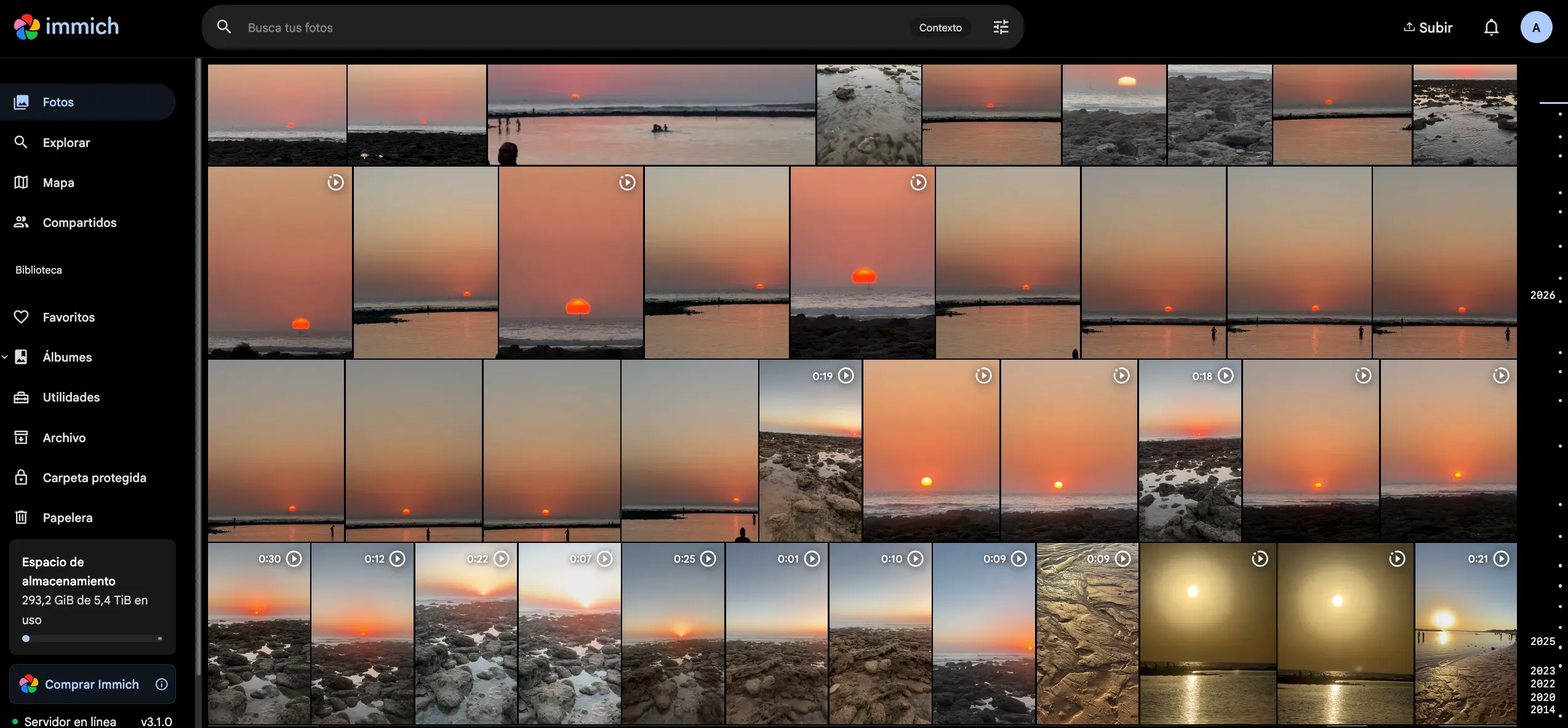 Immich showing the library timeline: a grid of beach sunset photos and videos, and the storage indicator at 293.2 GiB used out of 5.4 TiB